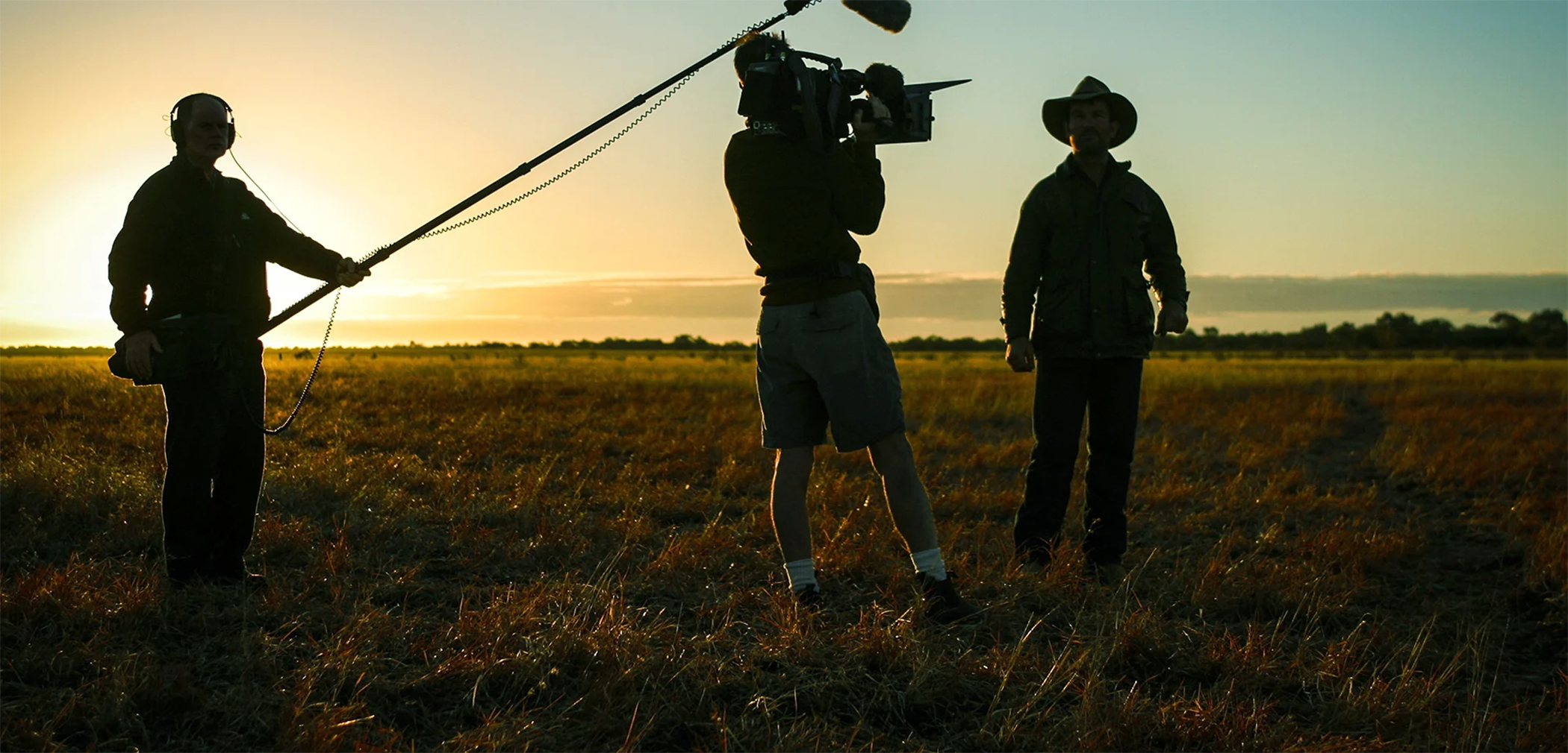 A film crew at dusk to illustrate do you need a degree to be a cinematographer.|