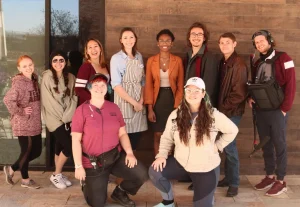 Shaylah Conley (lower left) with cast and crew of “First Impressions”